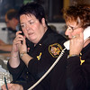 SmugMug > keywords > dispatch > (Front to Back) Darlene Burmeister, Judy Verb, and John Kokai work in the Sandusky County Sheriff Dispatch.Photo Ben French
